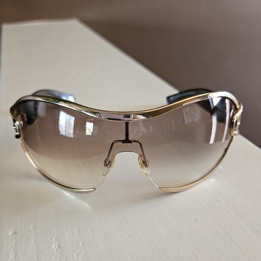 Gucci Gold Sunglasses With Buckles Sides.